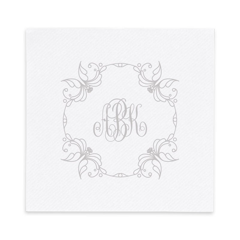 The Lily Monogram AirLaid Luxury Napkin features a floral design surrounding your monogram. 